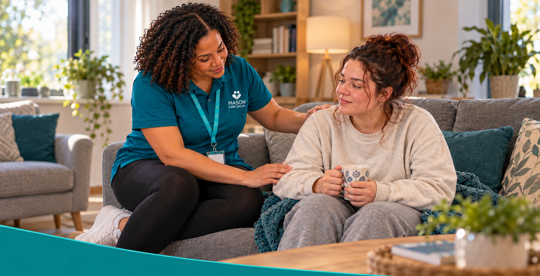 Kemi supports a younger adult after a seizure in a comfortable supported-living lounge.