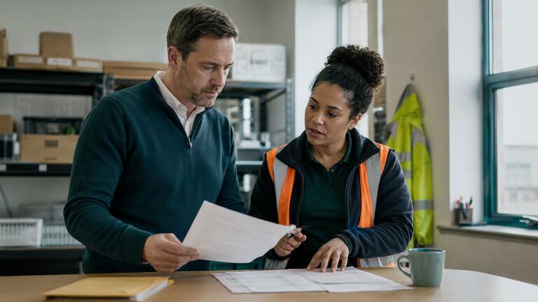 Colleagues discussing modern slavery awareness at work.